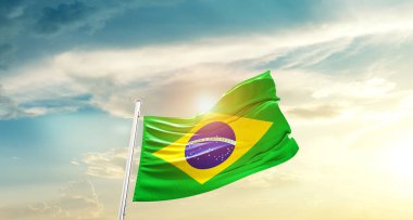 Brazil waving flag in beautiful sky with sun