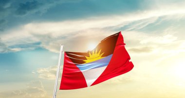 Antigua and Barbuda waving flag in beautiful sky with sun