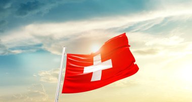 Switzerland waving flag in beautiful sky with sun