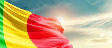 Mali waving flag in beautiful sky with sun