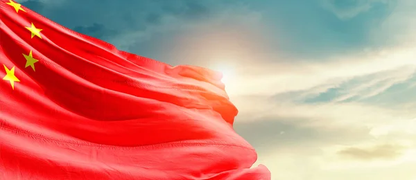 China waving flag in beautiful sky with sun