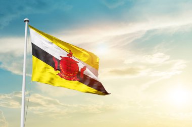 Brunei waving flag in beautiful sky with sun