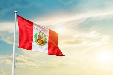 Peru waving flag in beautiful sky with sun