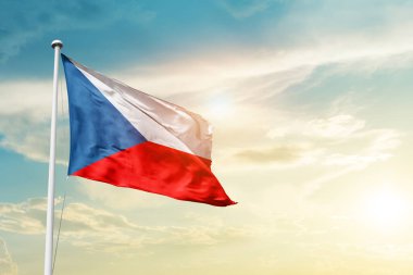 Czech Republic waving flag in beautiful sky with sun