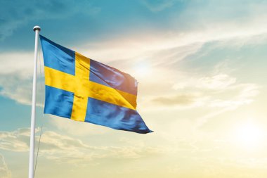 Sweden waving flag in beautiful sky with sun