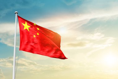 China waving flag in beautiful sky with sun