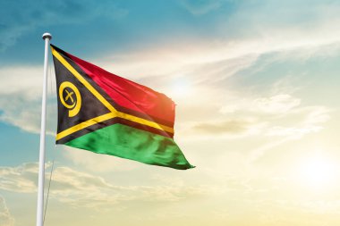 Vanuatu waving flag in beautiful sky with sun