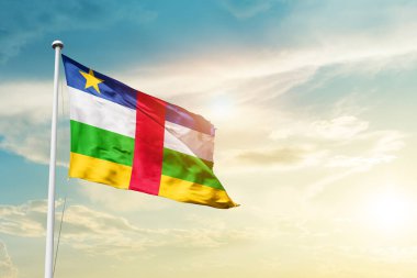 Central African Republic waving flag in beautiful sky with sun