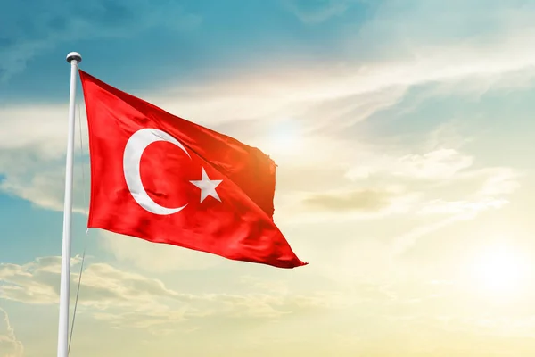 Turkey waving flag in beautiful sky with sun
