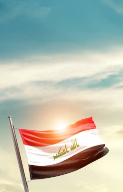 Iraq waving flag in beautiful sky with sun