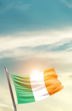 Ireland waving flag in beautiful sky with sun