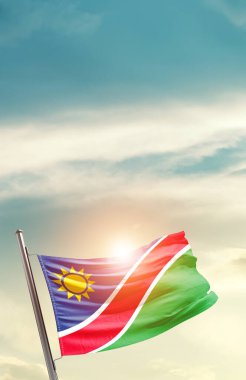 Namibia waving flag in beautiful sky with sun