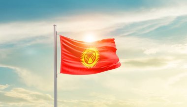 Kyrgyzstan waving flag in beautiful sky with sun