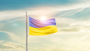 Ukraine waving flag in beautiful sky with sun