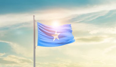 Somalia waving flag in beautiful sky with sun