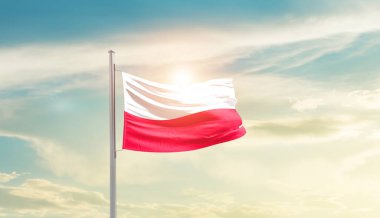 Poland waving flag in beautiful sky with sun