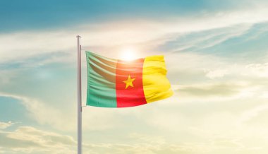 Cameroon waving flag in beautiful sky with sun