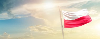 Poland waving flag in beautiful sky with sun