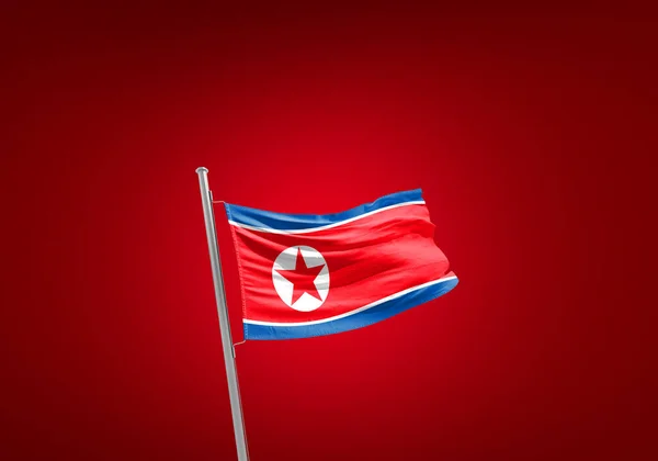 Прапор Північної Кореї Проти Червоного — стокове фото