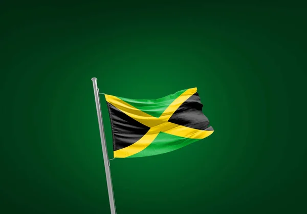 Jamaicas Flagg Mot Grønt – stockfoto