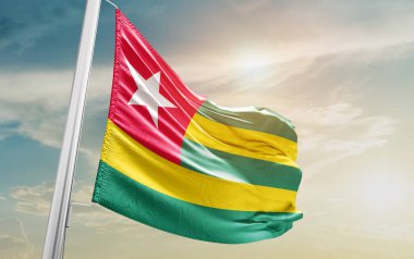 Togo waving flag against sky