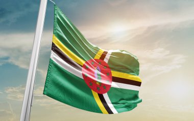 Dominica waving flag against sky