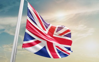 United Kingdom waving flag against sky