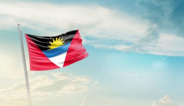 antigua and barbuda waving flag in beautiful sky.
