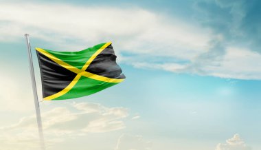 Jamaika bulutlu mavi gökyüzüne bayrak sallıyor