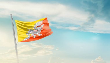 Bhutan bulutlu mavi gökyüzüne bayrak sallıyor