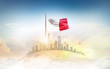 Şehir manzarasının üzerinde Malta bayrağı simgesi 