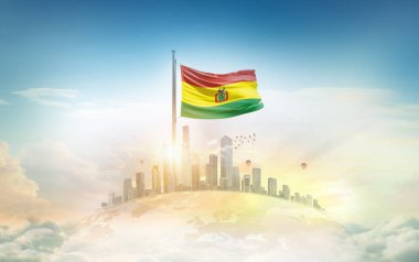 Şehir manzarasına karşı dalgalanan Bolivya bayrağı