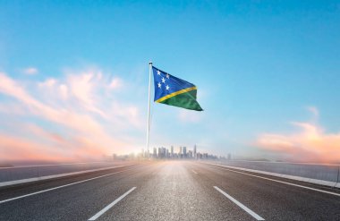 flag of Solomon Islands on the highway with cityscape view