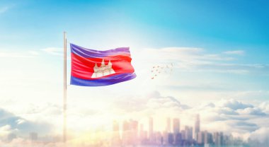 Şehir manzarasının üzerinde Kamboçya bayrağı simgesi 