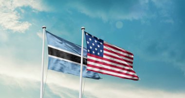 Botswana ulusal bayrağı bulutlar ve ABD bayrağıyla gökyüzünde dalgalanıyor