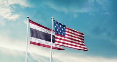 Mavi arka planda Amerikan ve Tayland bayrakları 
