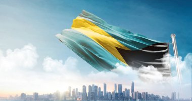 Bahamalar 'ın ulusal bayrağı gökyüzüne ve şehir binalarına dalgalanıyor.