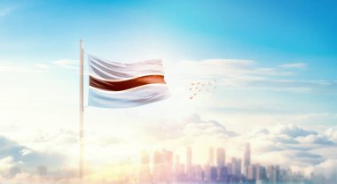 Güzel bina siluetinde sallanan Botswana ulusal bayrağı 