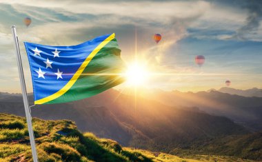 Solomon Adaları sıcak hava balonlarıyla günbatımında bayrak sallıyor.