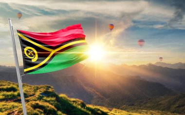 Vanuatu sıcak hava balonlarıyla günbatımında bayrak sallıyor.