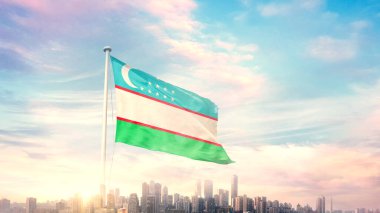 Özbekistan bayrağı mavi gökyüzü arka planında şehir manzarası ile dalgalanıyor 