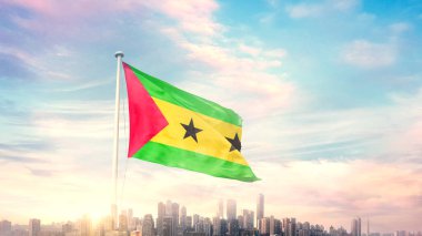 Sao Tome ve Principe bayrağı mavi gökyüzü arka planında şehir manzarası ile dalgalanıyor 