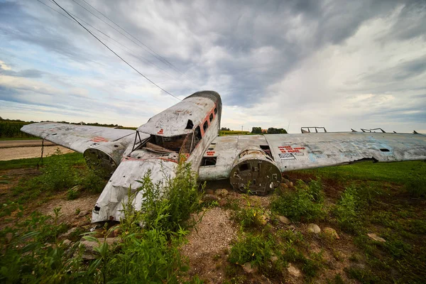Image of Looking at front of crashed airplane in fields of America
