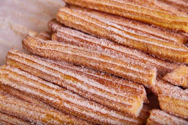 Churros Duvarı 'nın görüntüsü yıldız şeklinde Meksika usulü tarçın şekerli hamur işi.