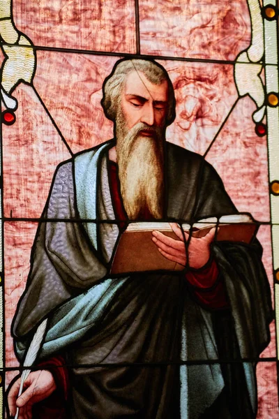 stock image Image of Mathew, Mark, John, or Luke apostle saint holding Christian bible book and quill church window
