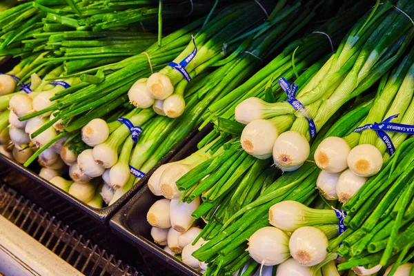 stock image Image of Black baskets of spring onions with bulbs background asset