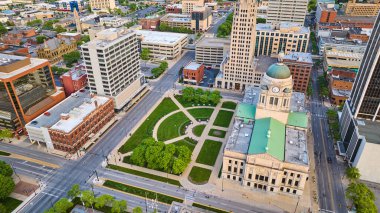 Image of Wide shot of side view aerial Allen County courthouse and office buildings in downtown Fort Wayne clipart