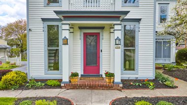 Image of 1225 real estate house property rent asset magenta door white siding blue window frames flowerbed clipart