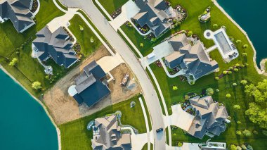 Image of Rich homes landscaping and construction of new home aerial clipart