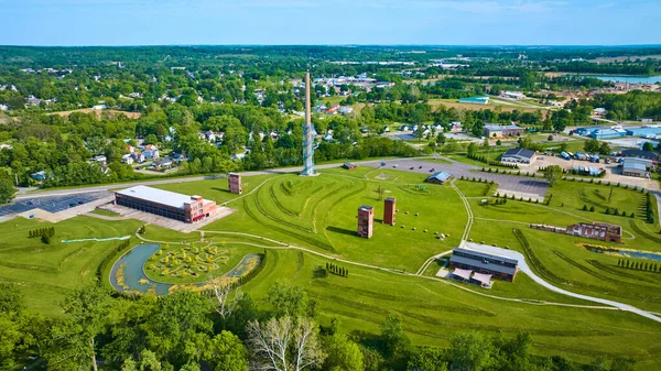 Image of Distant city of Mount Vernon Ohio in drone view of destroyed factory at Ariel Foundation Park trails